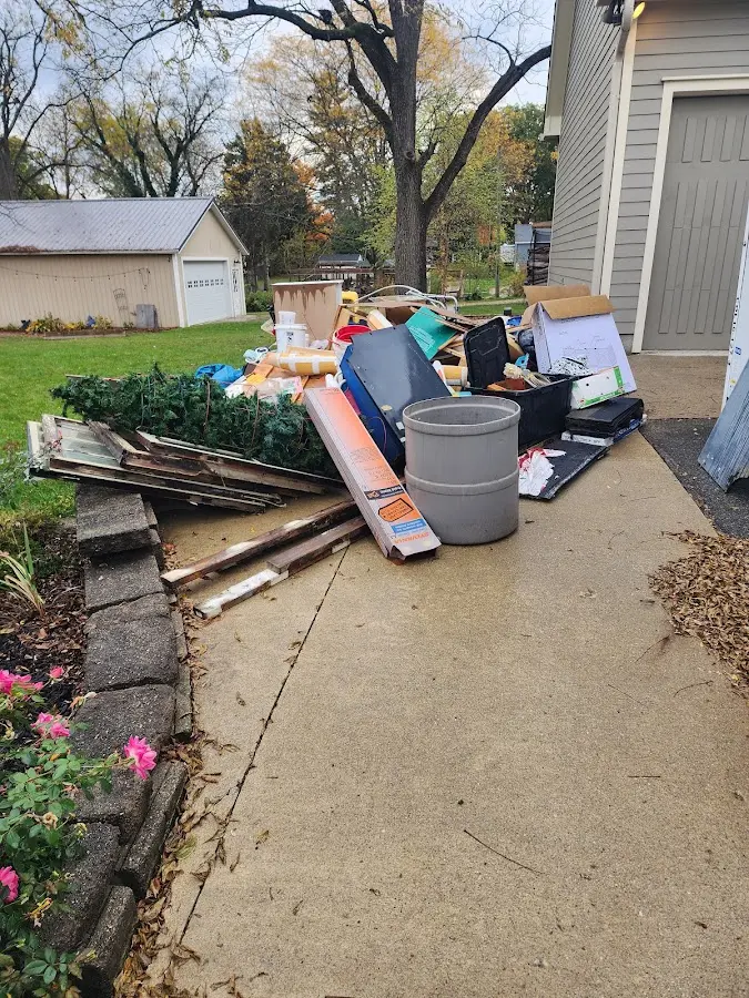Dumpster being loaded with debris for Residential Dumpster Rental in Nocatee